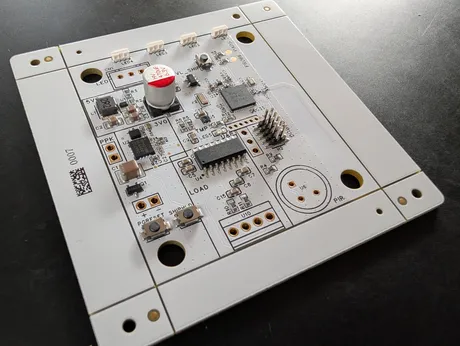 Verte four-layer PCB, unpopulated panel edge visible, with nRF54L15 and nPM2100 fitted
